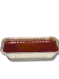 red chili sauce in an aluminum foil on a white background