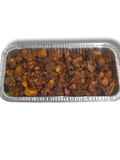 Fried dodo gizzard in a metal tray on a white background