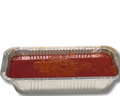 Aluminum foil pan with red sauce on a white background